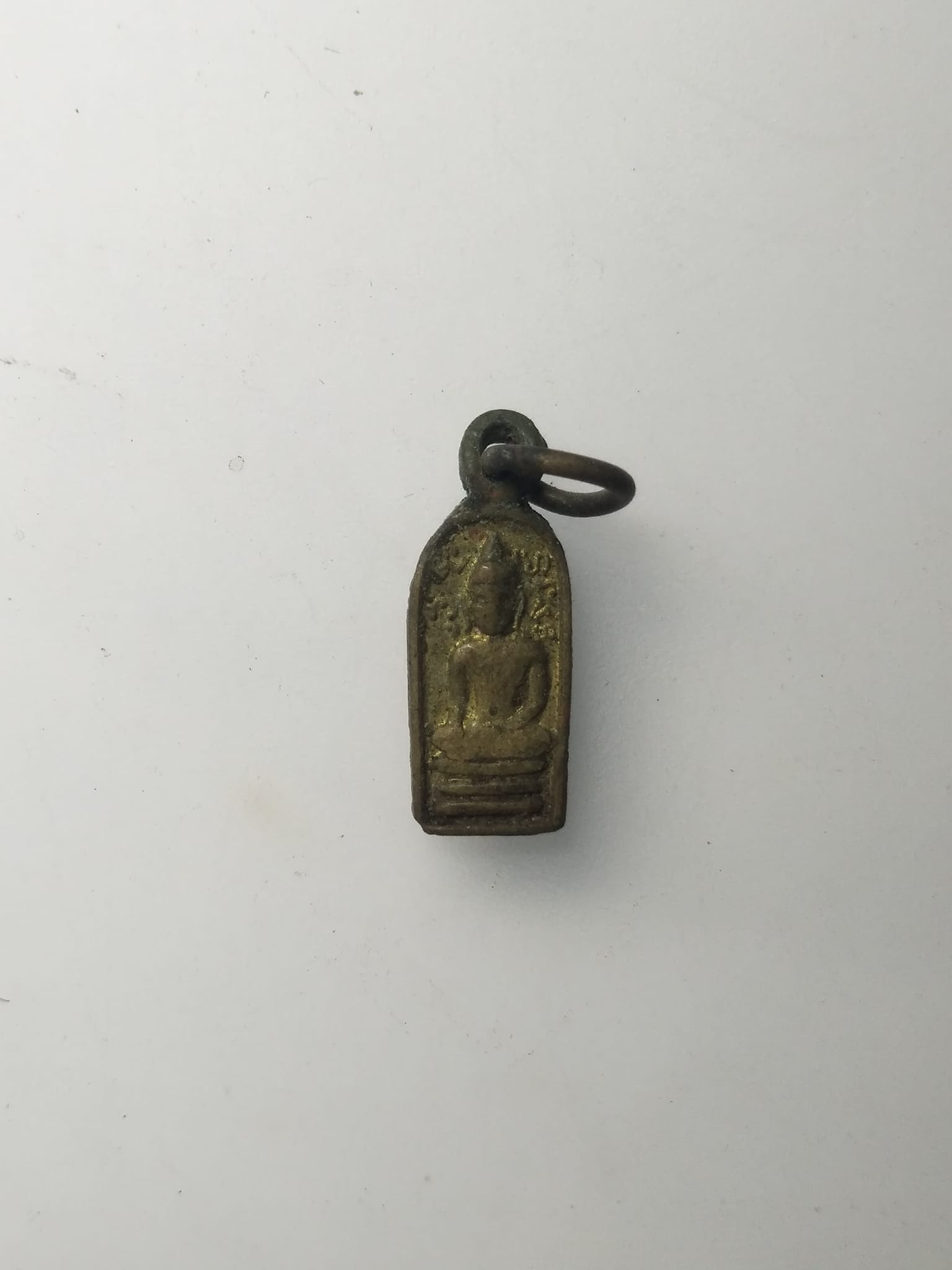 H282 เหรียญใบมะขามพระพุทธหลังนางกวัก