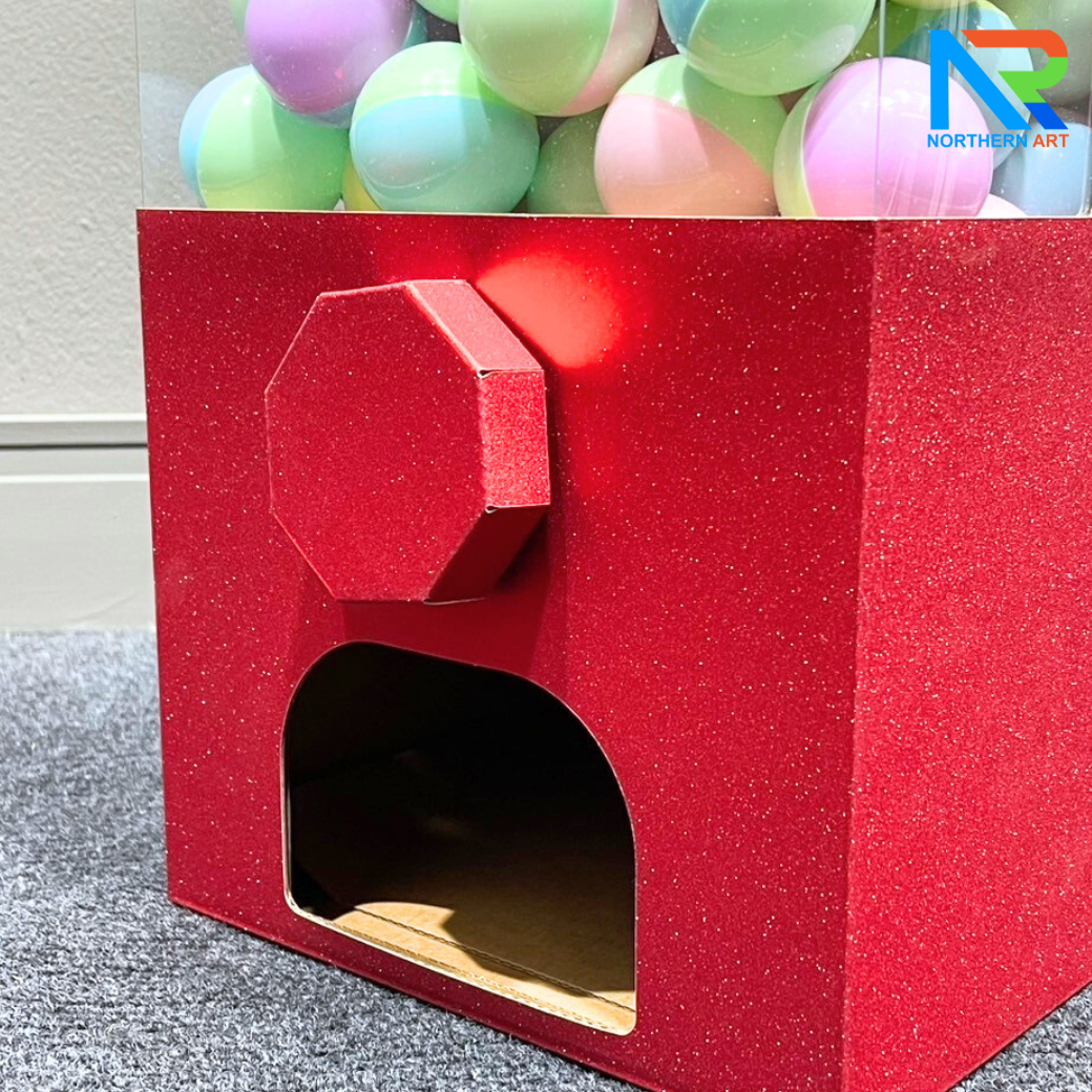 เกมส์หมุนบอล จับรางวัล ตั้งโต๊ะ กล่องสีแดง ขนาด 23 x 18 x 35 cm. พร้อมลูกบอลใส่ฉลาดขนาด 45 มม. จำนวน 40 ลูก