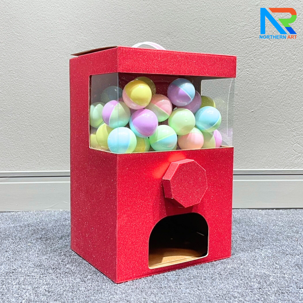 เกมส์หมุนบอล จับรางวัล ตั้งโต๊ะ กล่องสีแดง ขนาด 23 x 18 x 35 cm. พร้อมลูกบอลใส่ฉลาดขนาด 45 มม. จำนวน 40 ลูก