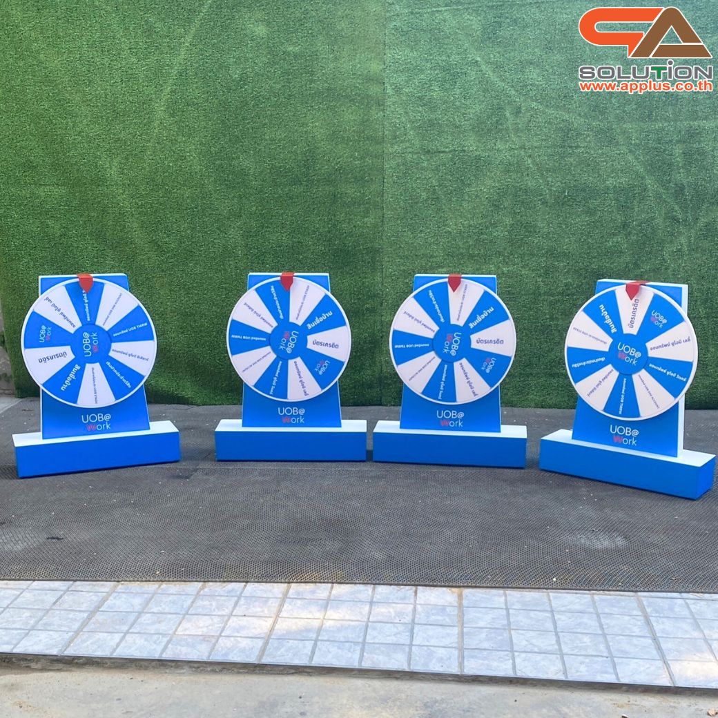 เกมส์วงล้อตั้งโต๊ะ รุ่นเหล็ก ขนาดวงล้อ 40 ซม. สูง 60 cm. สีขาว พร้อมงานพิมพ์สติ๊กเกอร์ ออกแบบได้ตามความต้องการ