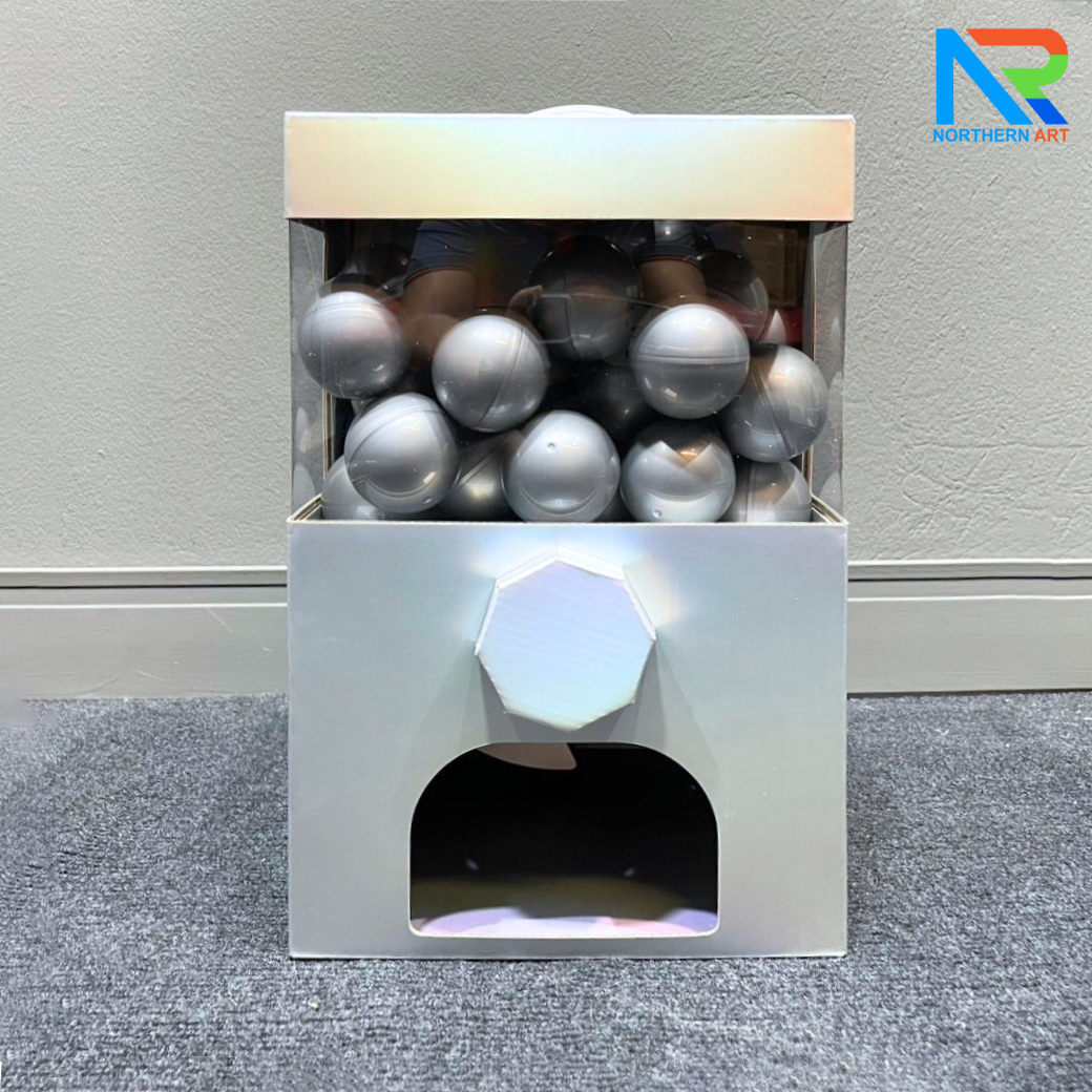 เกมส์หมุนบอล จับรางวัล ตั้งโต๊ะ กล่องสีเทา ขนาด 24.5 x 19.5 x 36.5 cm. พร้อมลูกบอลใส่ฉลาดขนาด 55 มม.จำนวน 30 ลูก