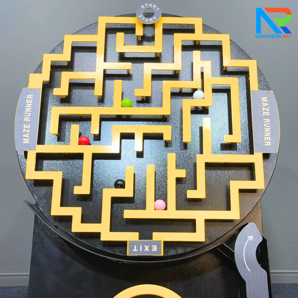 เกมส์เขาวงกต รุ่นพวงมาลัยรถ ขนาด (W)70 x (D)60 x (H)145 cm. โครงเหล็กพ่นสีอุตสาหกรรมพร้อมล้อเลื่อน ลูกแก้วคละสี 5 ลูก